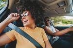 Happy friends traveling by car